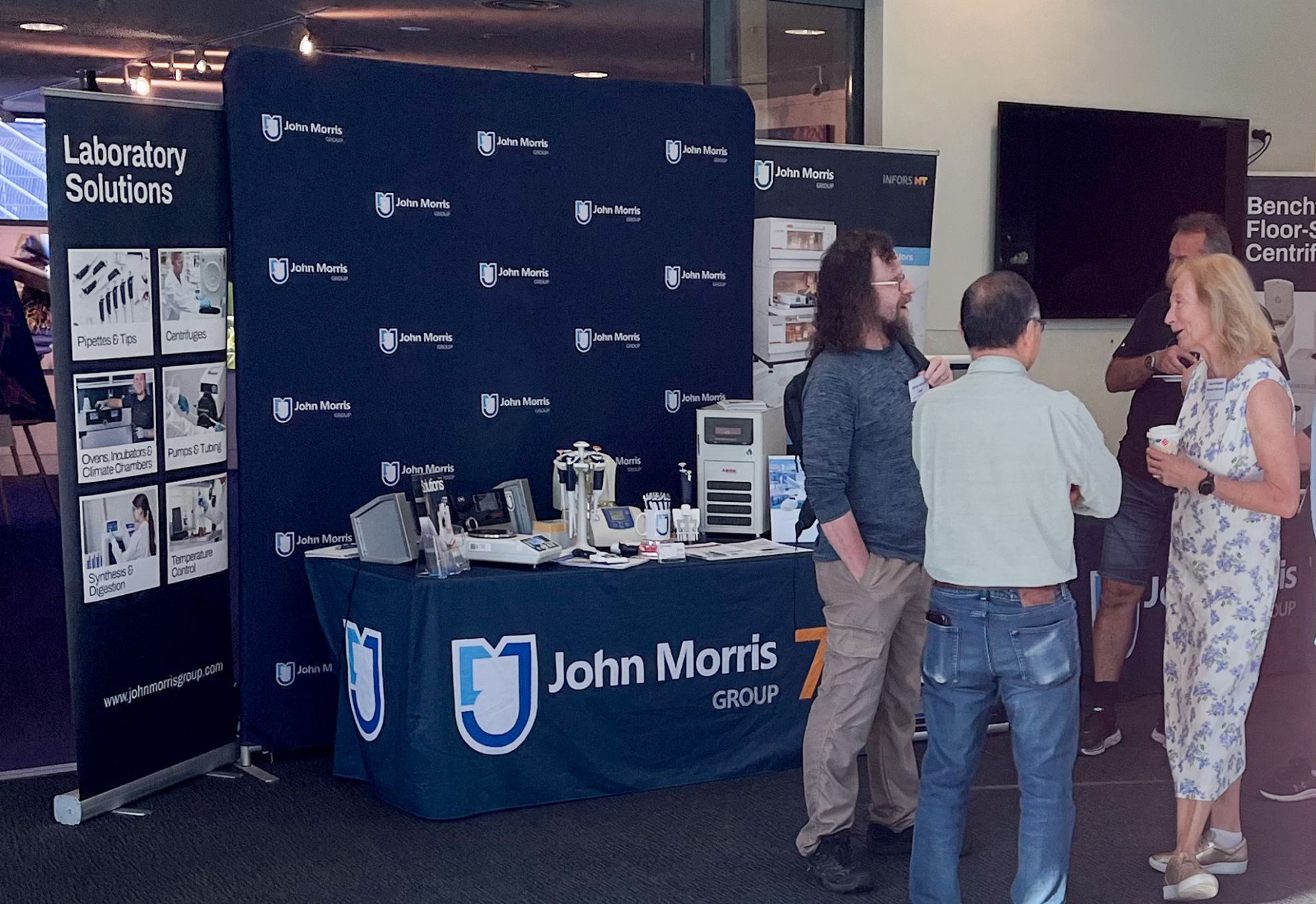 John Morris Group stand at CSIRO Equity in Science 2026, displaying laboratory solutions including pipettes, centrifuges, ovens, temperature control instruments and Infors HT equipment