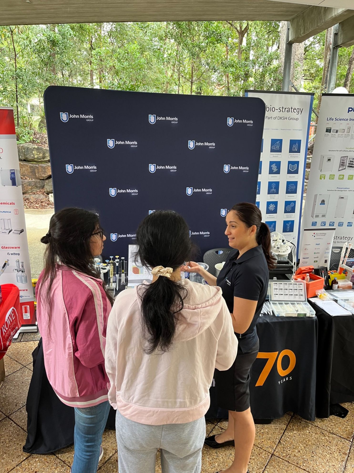 John Morris Group specialist advising researchers at an Australian university laboratory expo