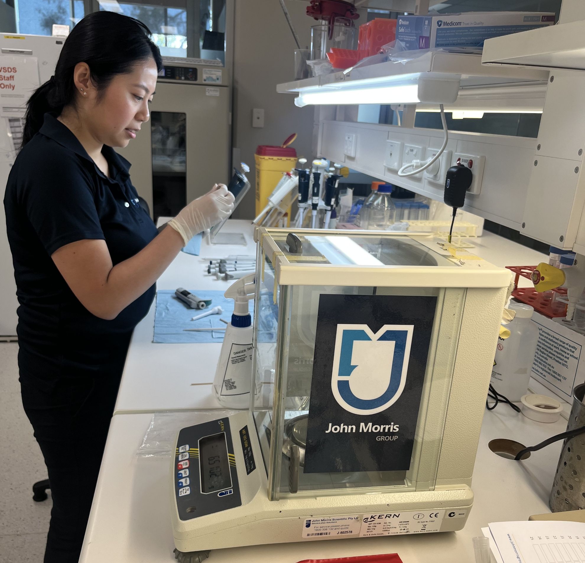 John Morris Group technician performing pipette calibration service at an Australian laboratory