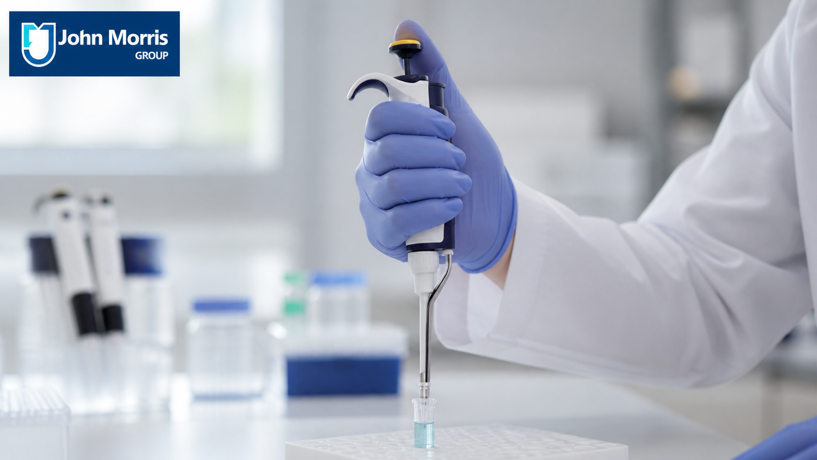 Lab technician using an ergonomic pipette comfortably at the bench