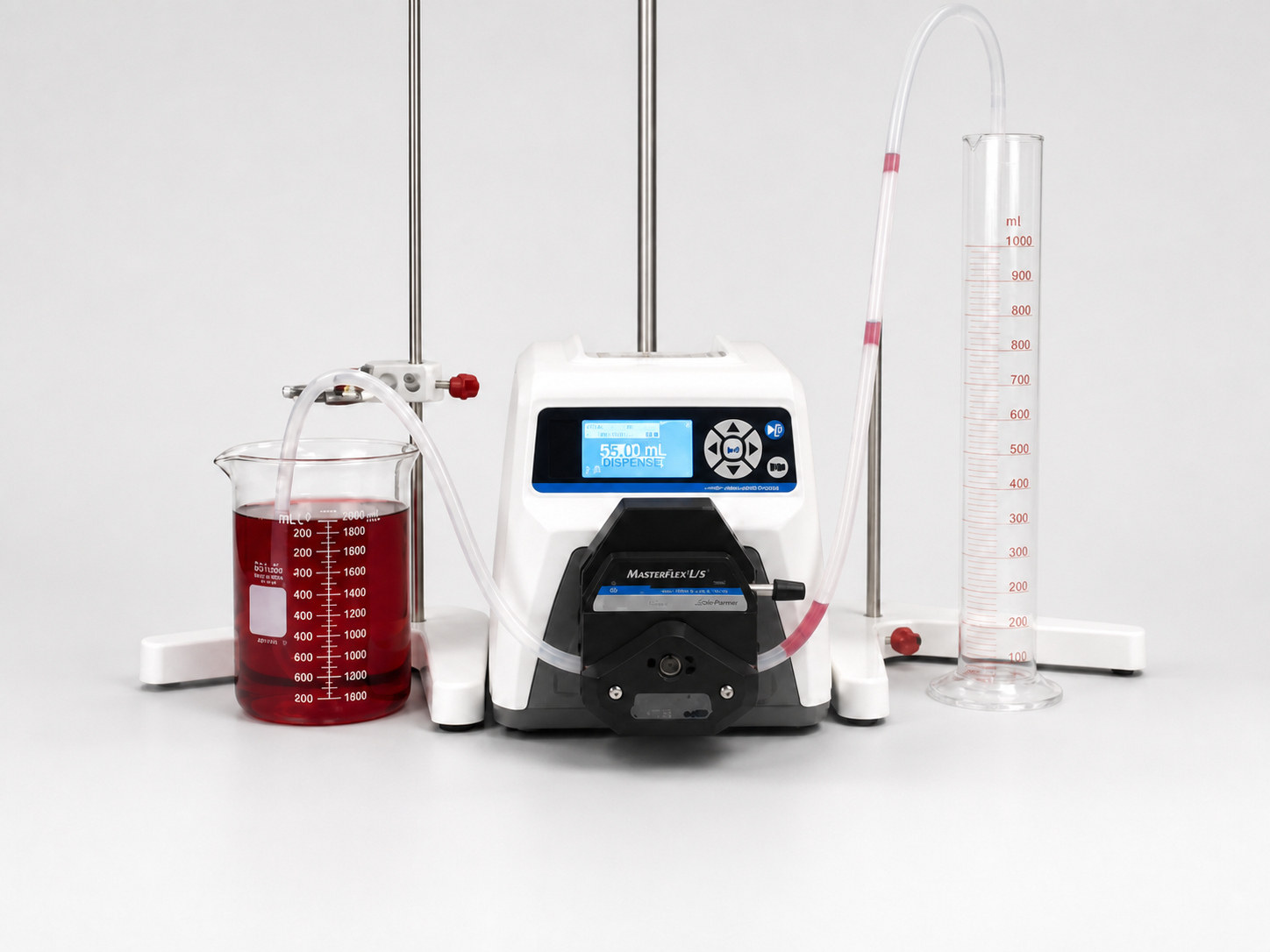 Hand reaching to turn on the Masterflex L/S digital drive with the pump already connected to tubing