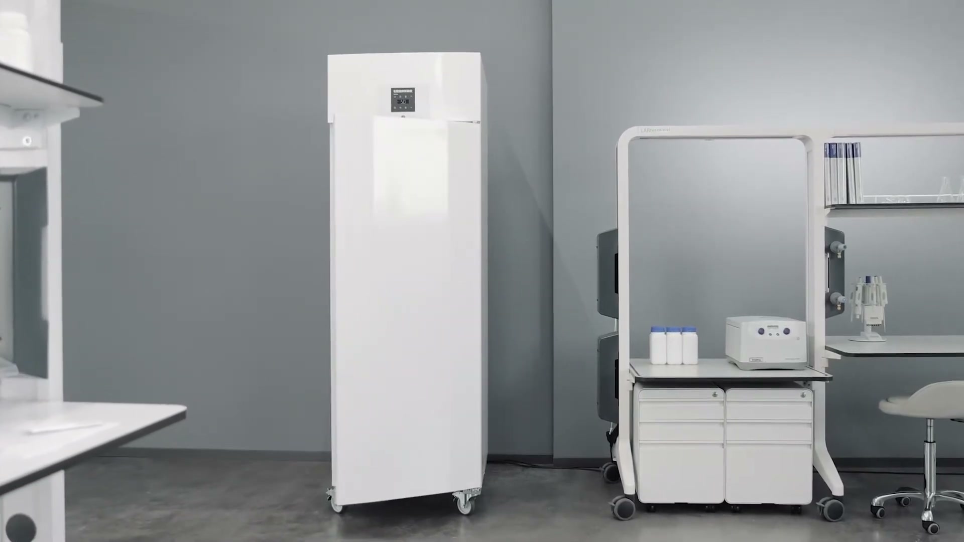 Liebherr MediLine laboratory fridge standing in a lab setting next to a LABterminal mobile workstation